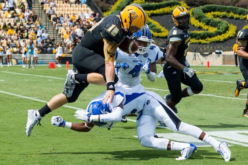 Kennesaw State University Football Players During a Game Photograph