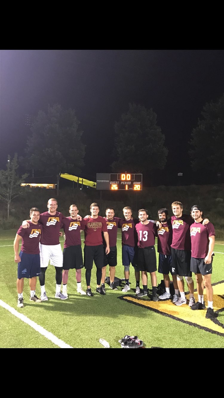 Ten Mu Beta Chapter Members On a Football Field Photograph