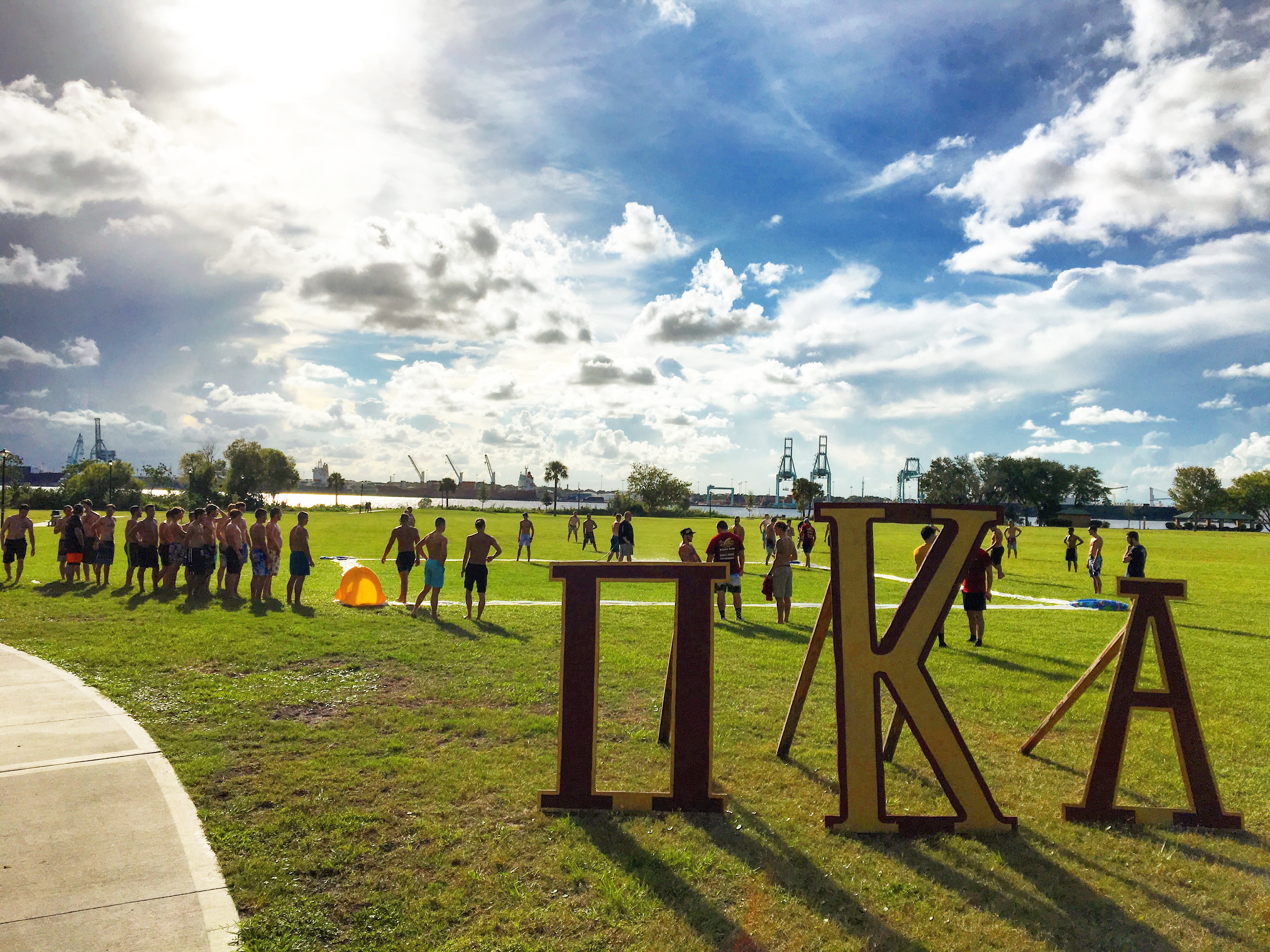 Mu Mu Chapter Members Play A Game Outside Photograph