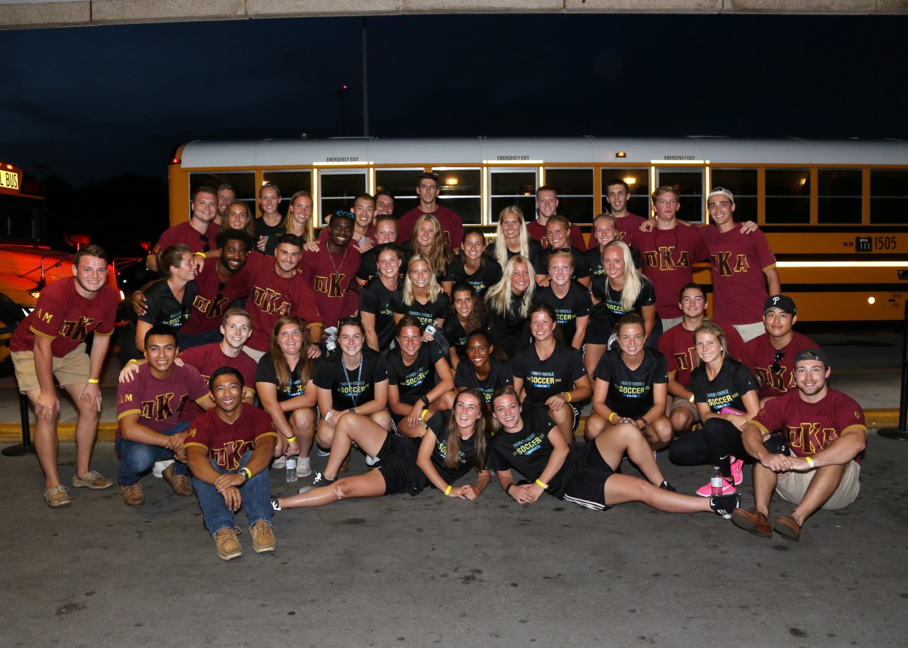 Lambda Mu Chapter Members Pose with ERAU Soccer Players Photograph