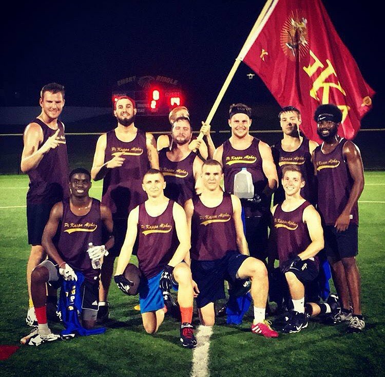 Lambda Mu Athletes with a PIKE Flag Photograph