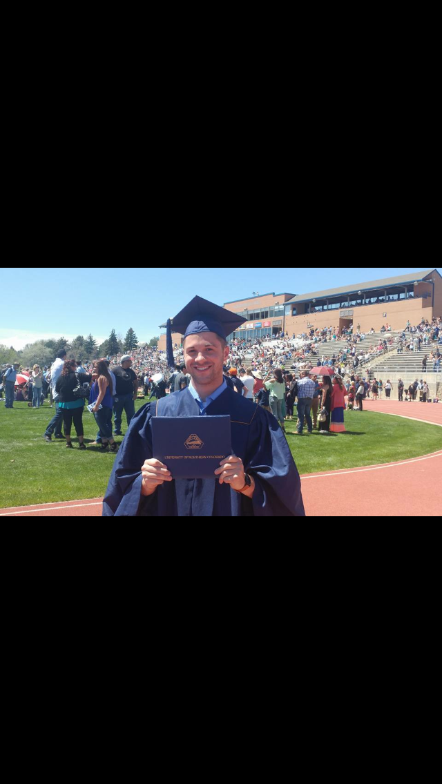 Mu Tau Chapter Graduate with Diploma Holder Photograph