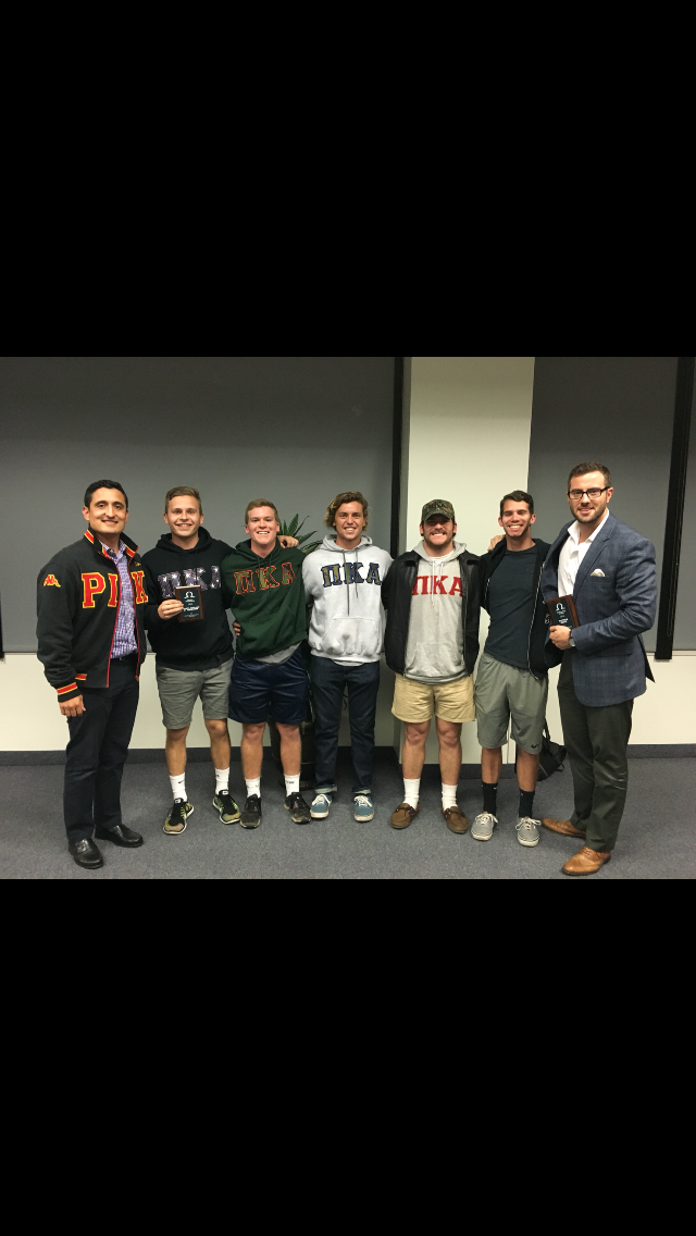 Seven Theta Psi Chapter Members with Awards Photograph