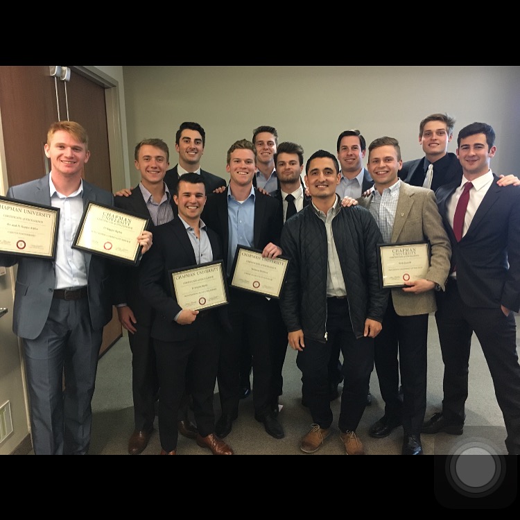 Twelve Theta Psi Chapter Members Stand with Awards Photograph