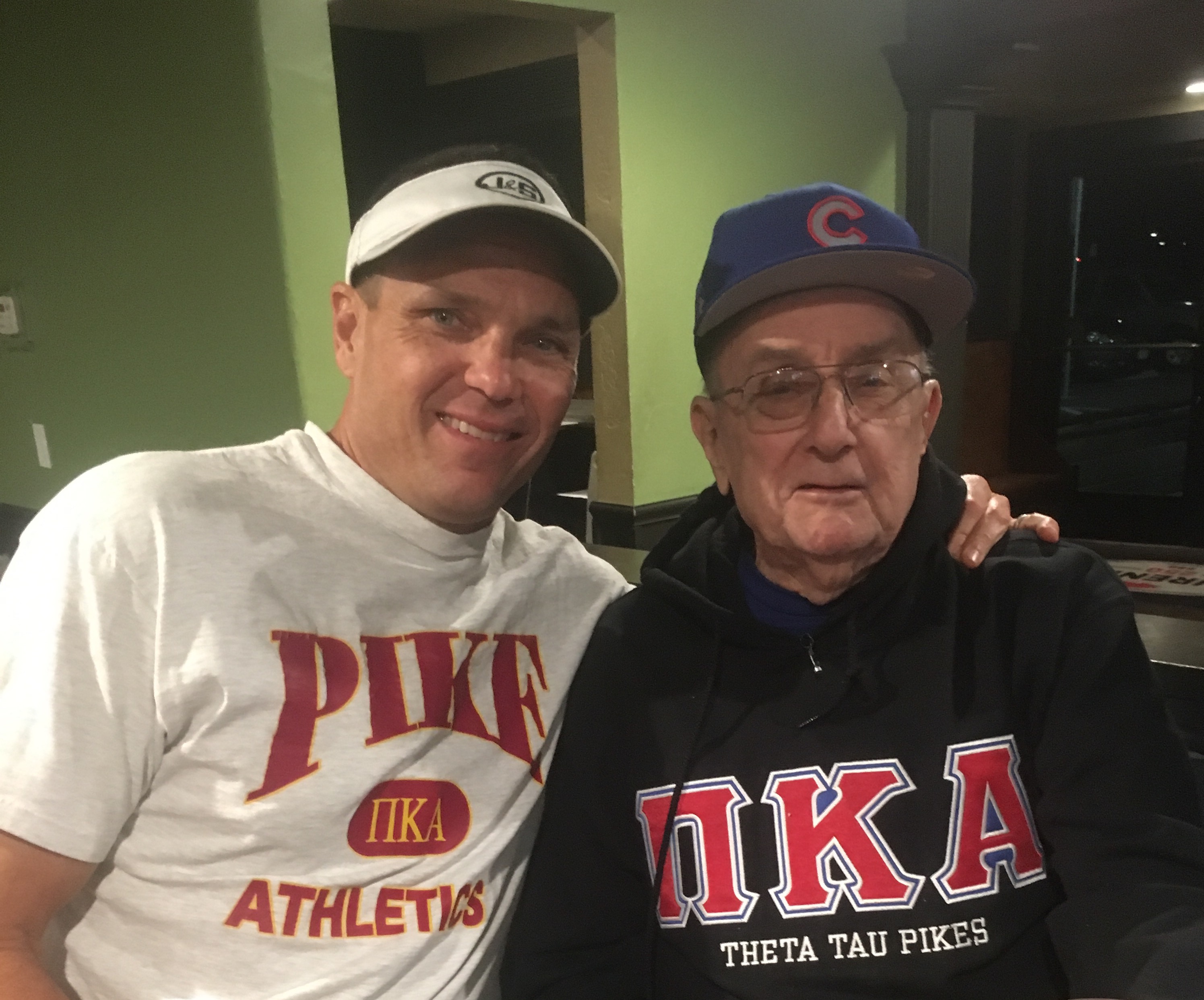 Two Men Wearing Pi Kappa Alpha Athletic Apparel Photograph