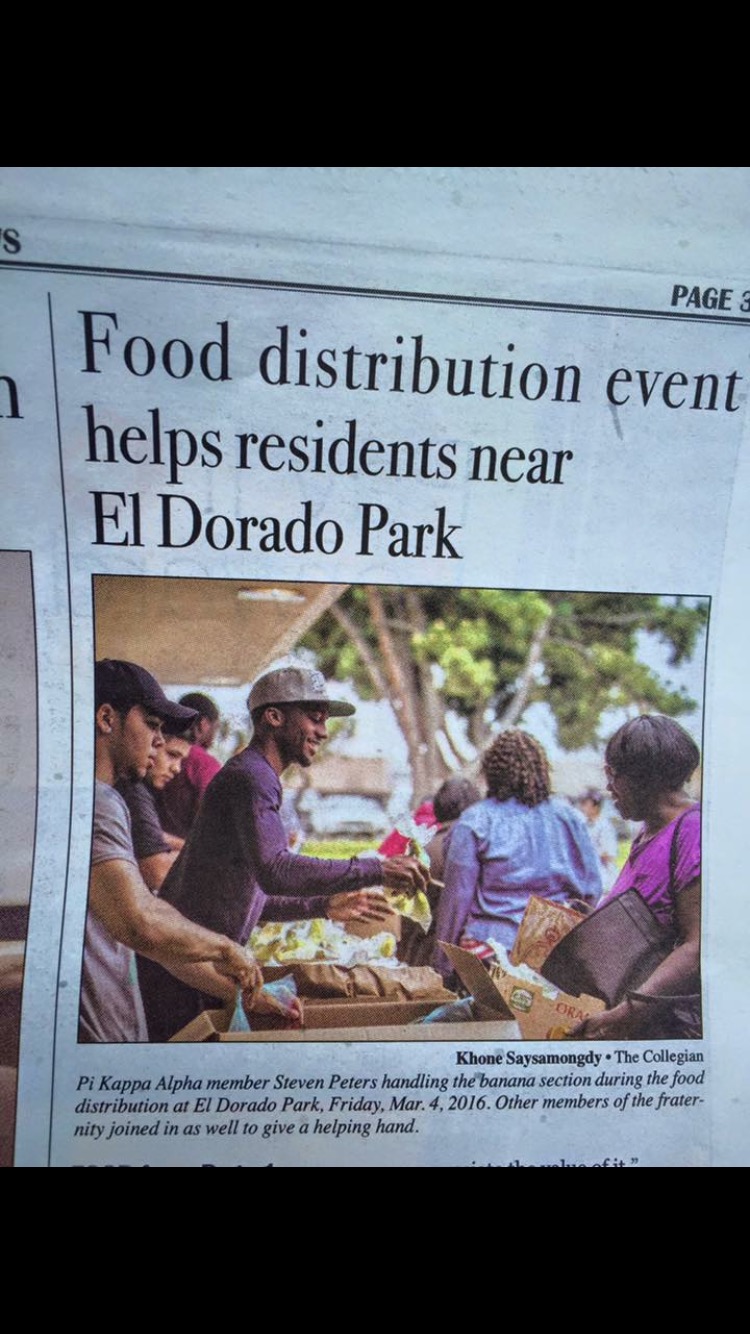 Iota Beta Chapter Members Distributing Food Photograph