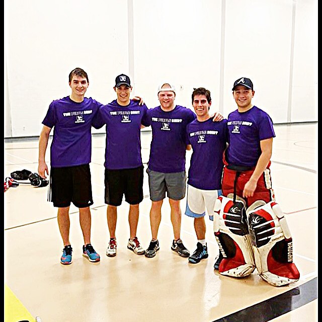 Five Iota Omega Chapter Members Play Floor Hockey Photograph