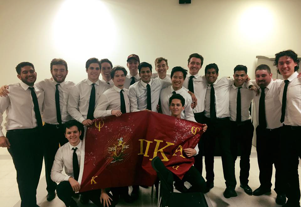 Mu Delta Chapter Members Posing with a PiKA Flag Photograph