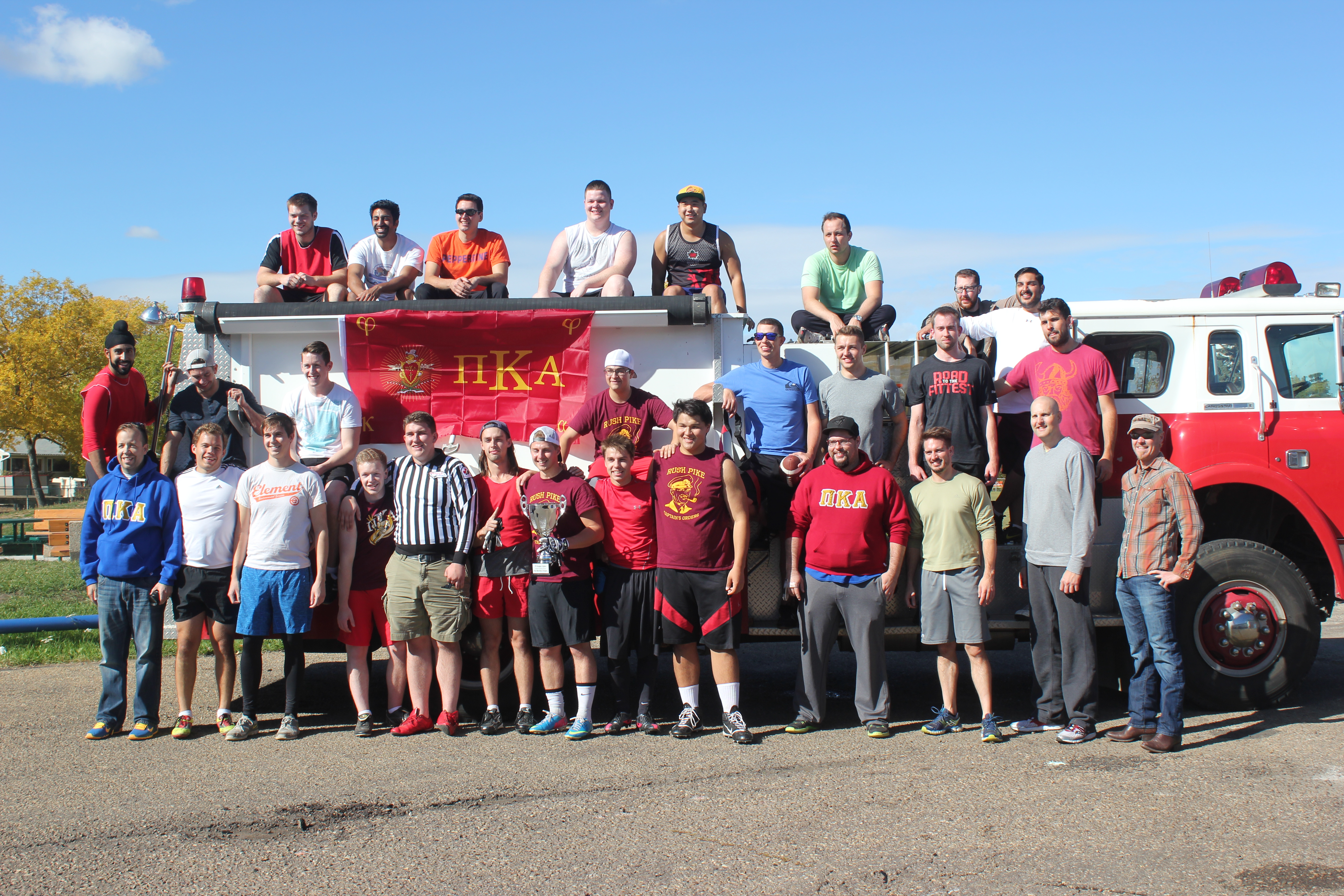 Lambda Epsilon Chapter Members with a Fire Truck Photograph