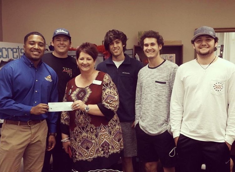Five Eta Epsilon Chapter Members Present A Check to Unidentified Photograph