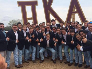 Theta Theta Chapter Members in Jeans and Suit Jackets Photograph