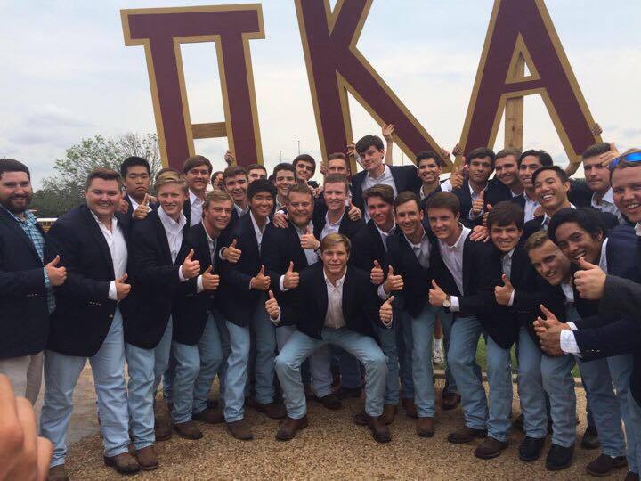 Theta Theta Chapter Members in Jeans and Suit Jackets Photograph