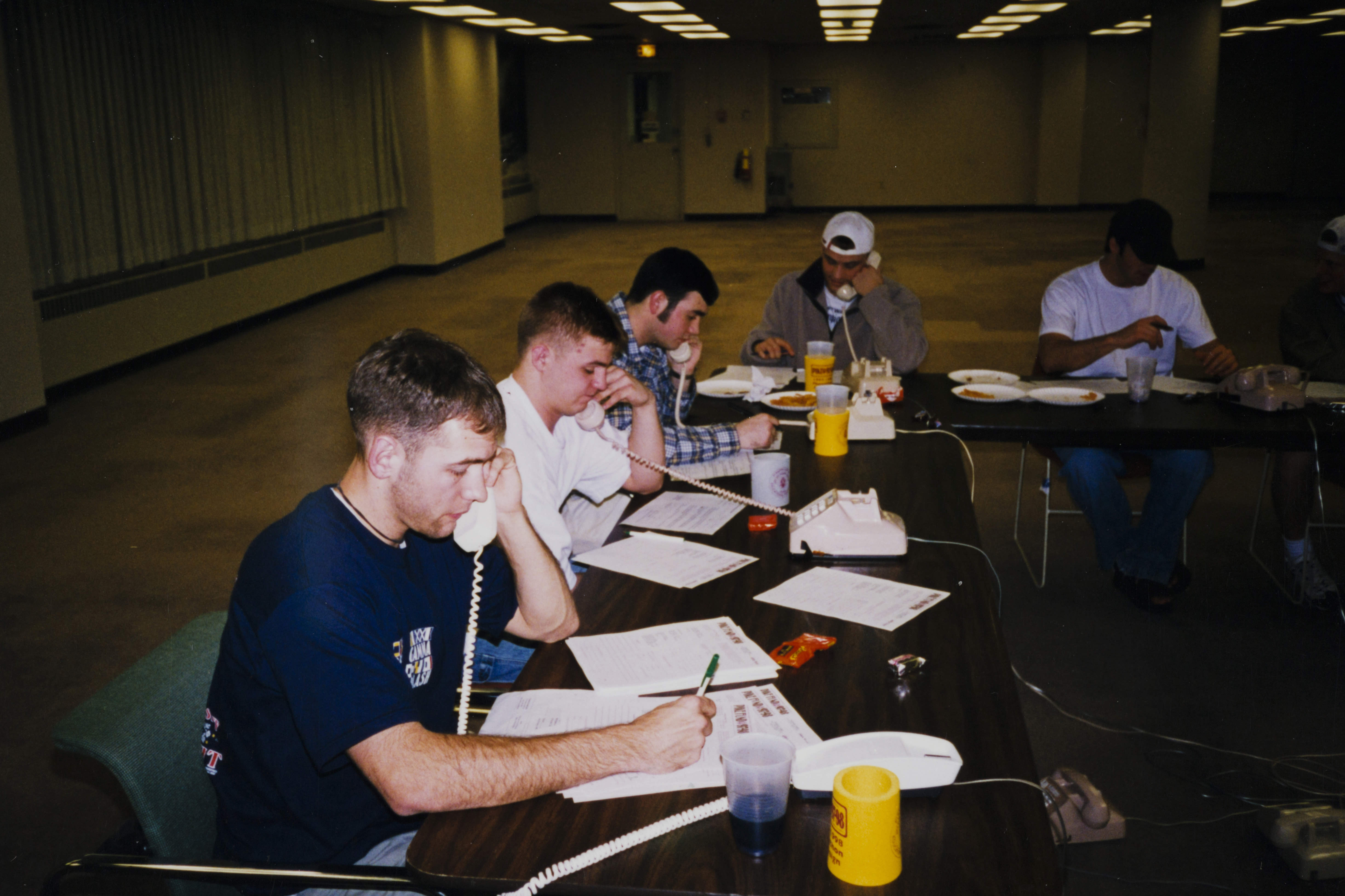 Theta Omicron Chapter Members on Phones Photograph 1