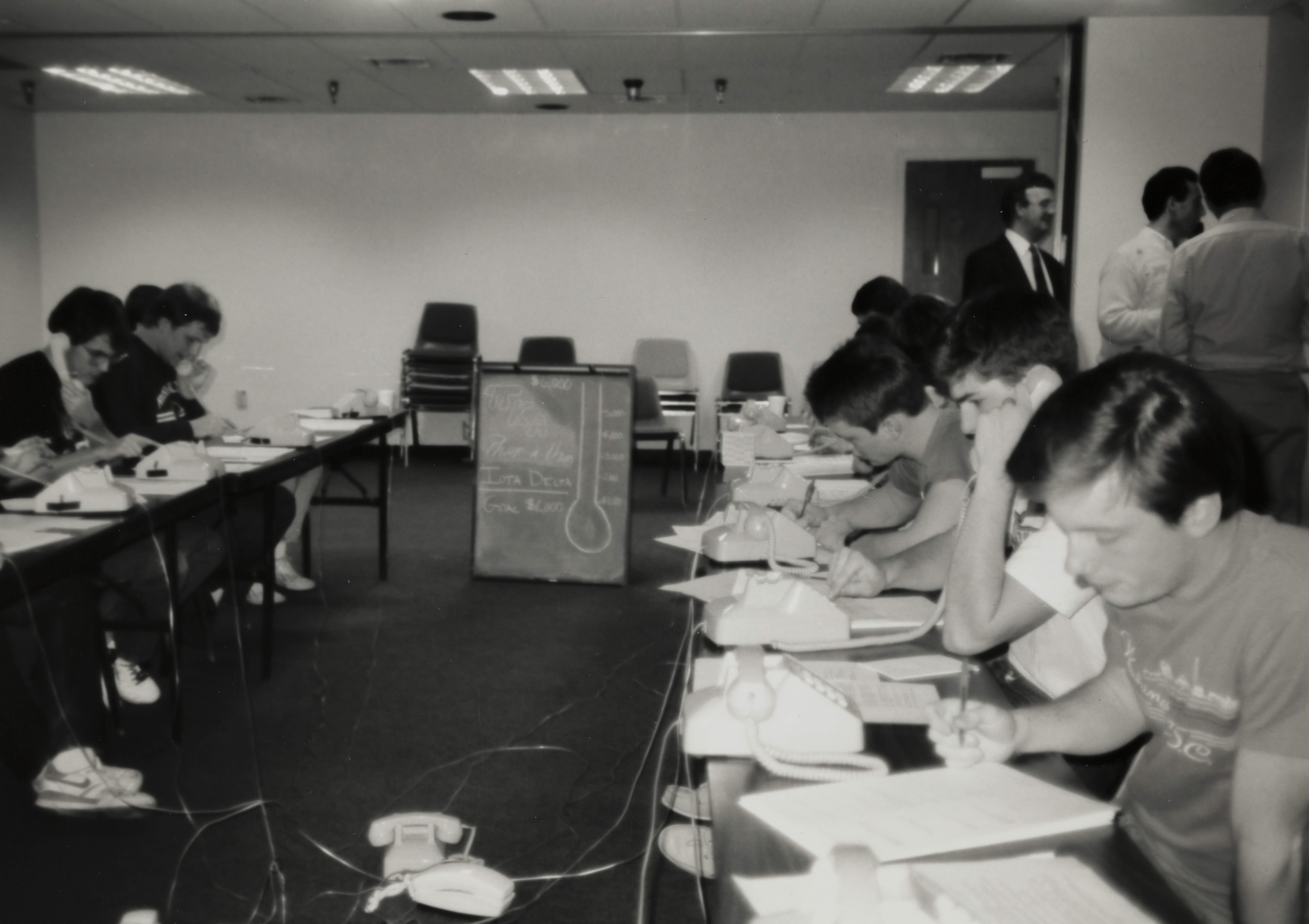 Theta Omicron Chapter Members on Phones at Phone-A-Thon Photograph 6, 1989