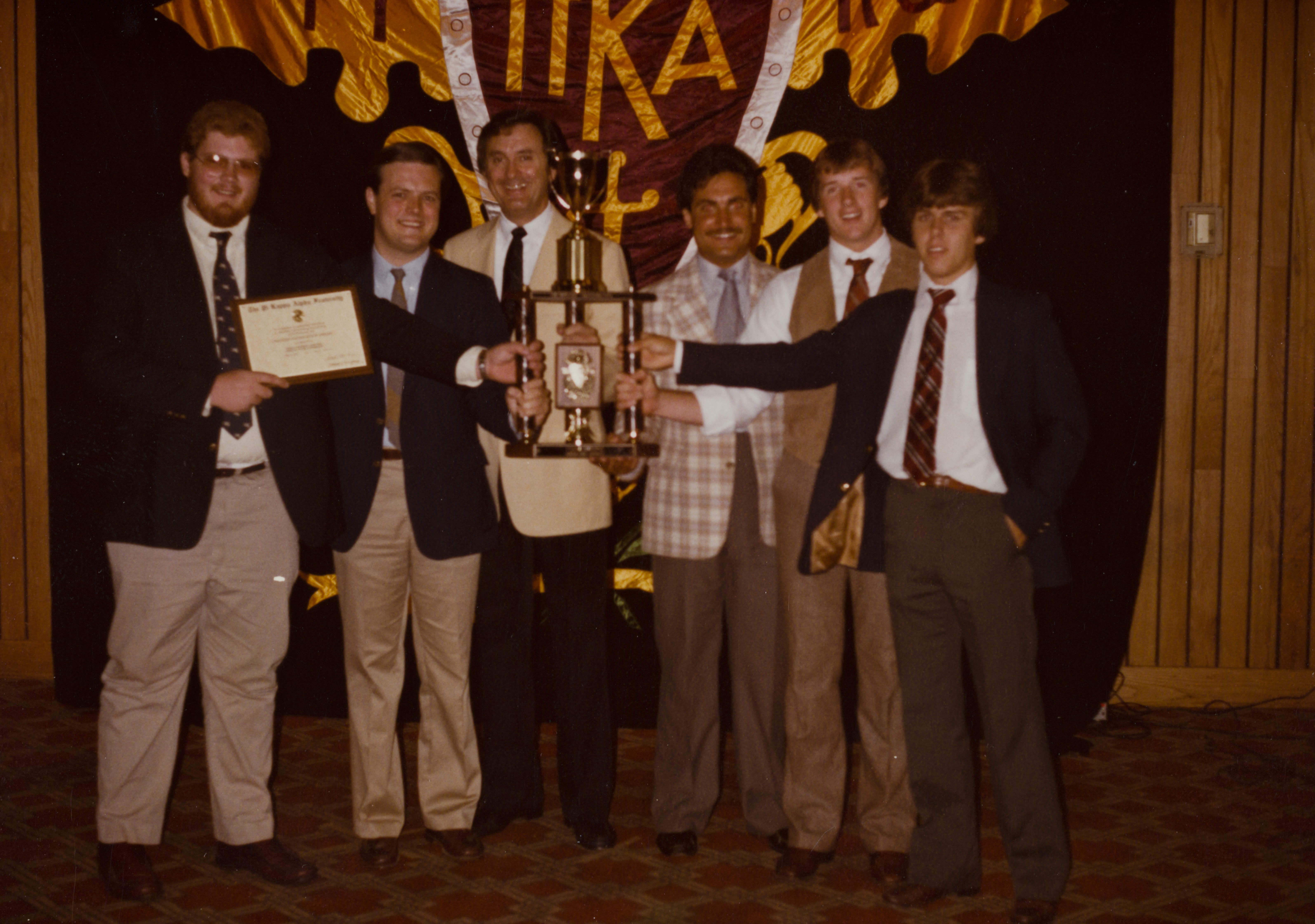 Six Theta Omicron Chapter Members with Trophy Photograph