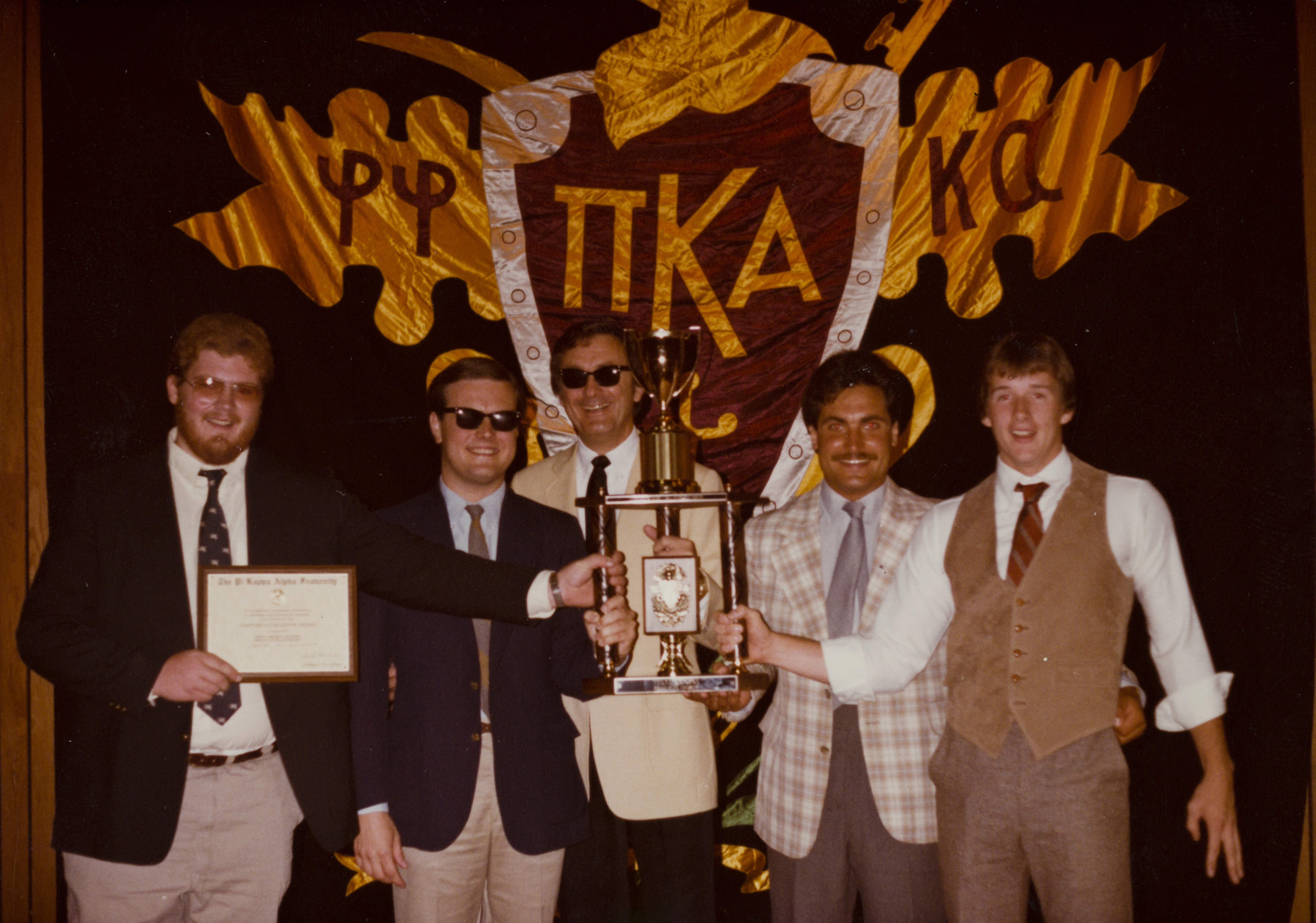 Five Theta Omicron Chapter Members with Trophy Photograph