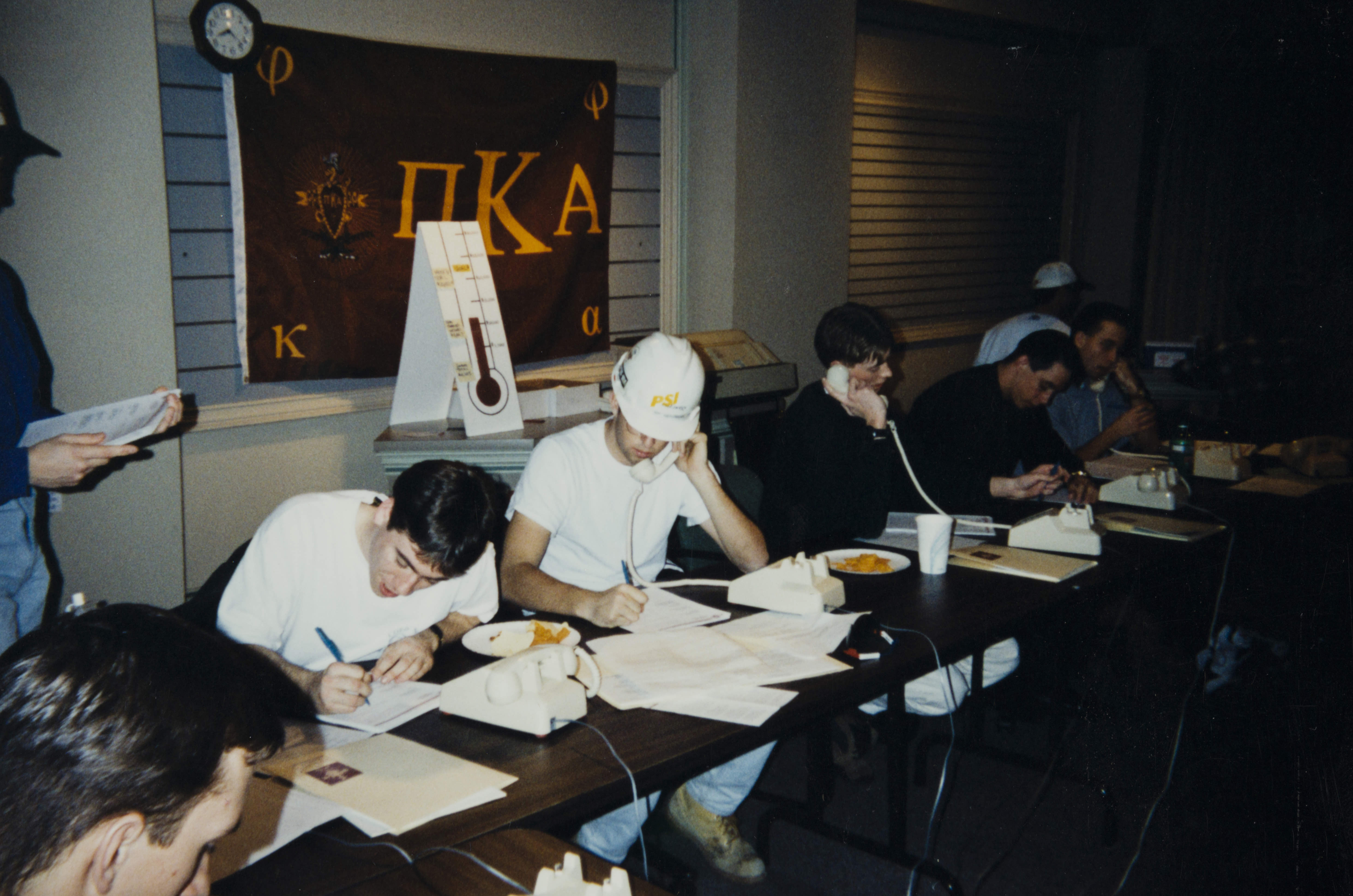 Theta Omicron Chapter Members on Phones Photograph 2