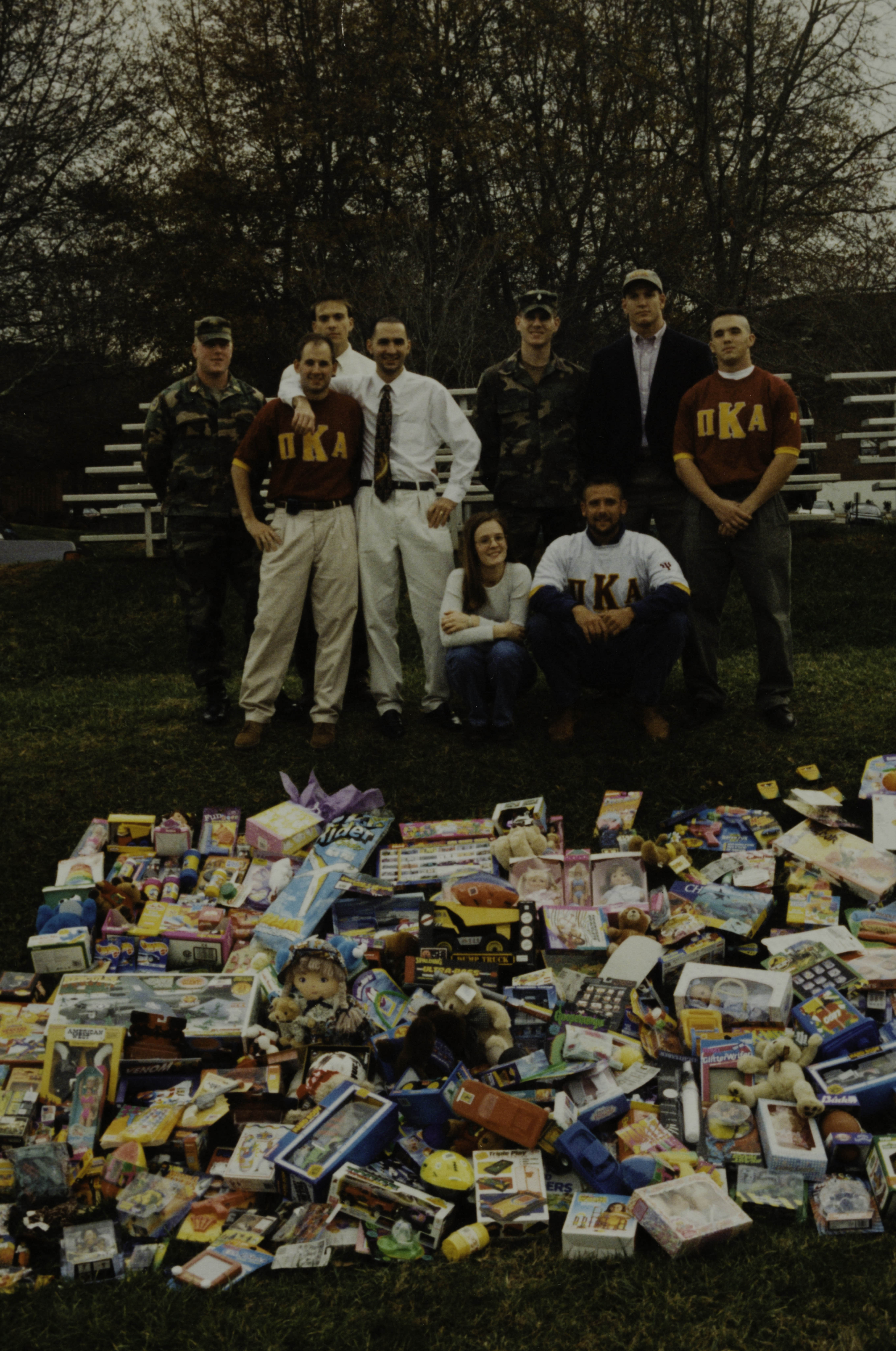 Unidentified Pose With Toys on Lawn Photograph, c. 1990s