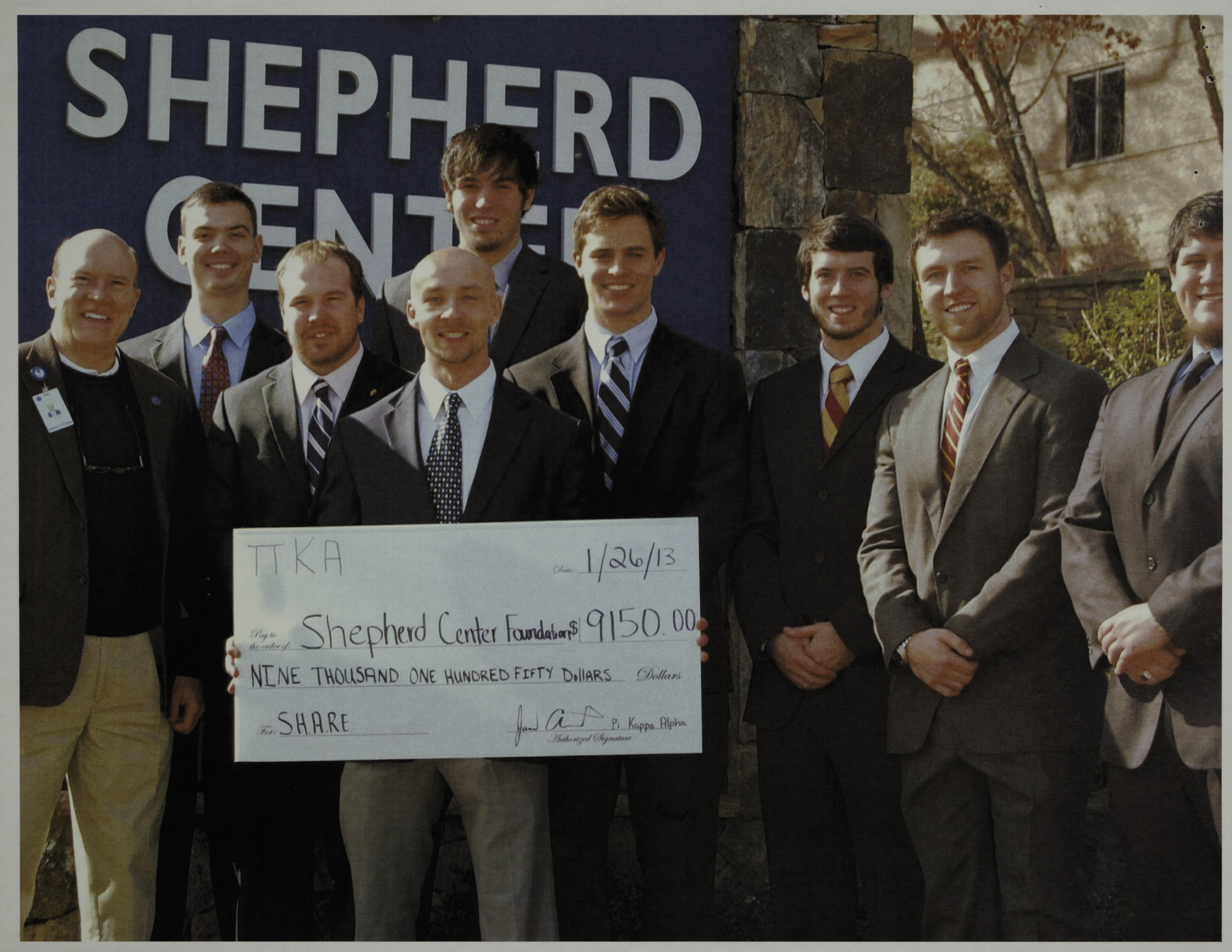 Nine Psi Chapter Members With Giant Check Photograph, January 26, 2013