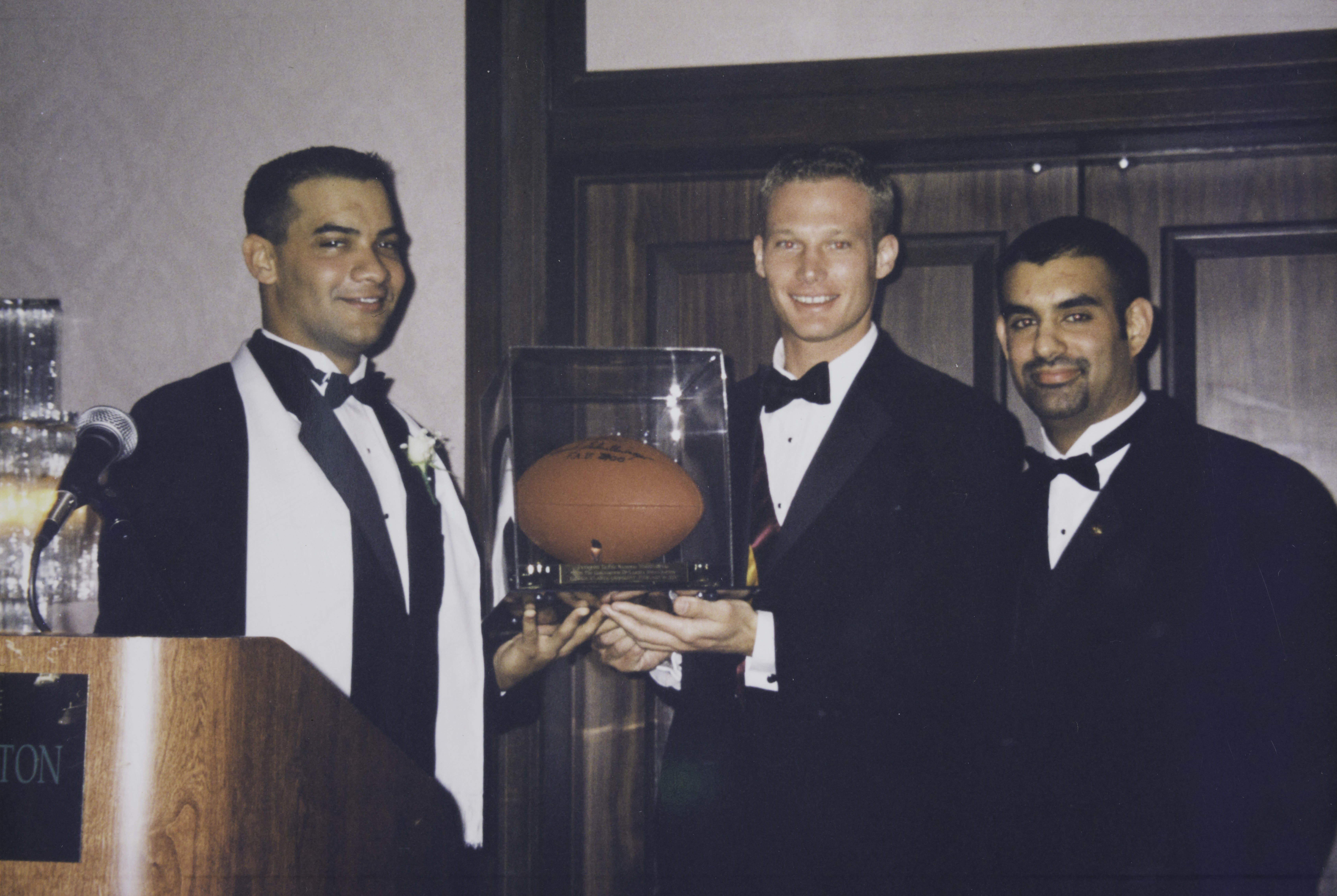 Mota, Flickinger and Reboa With Football Trophy Photograph, February 19, 2000