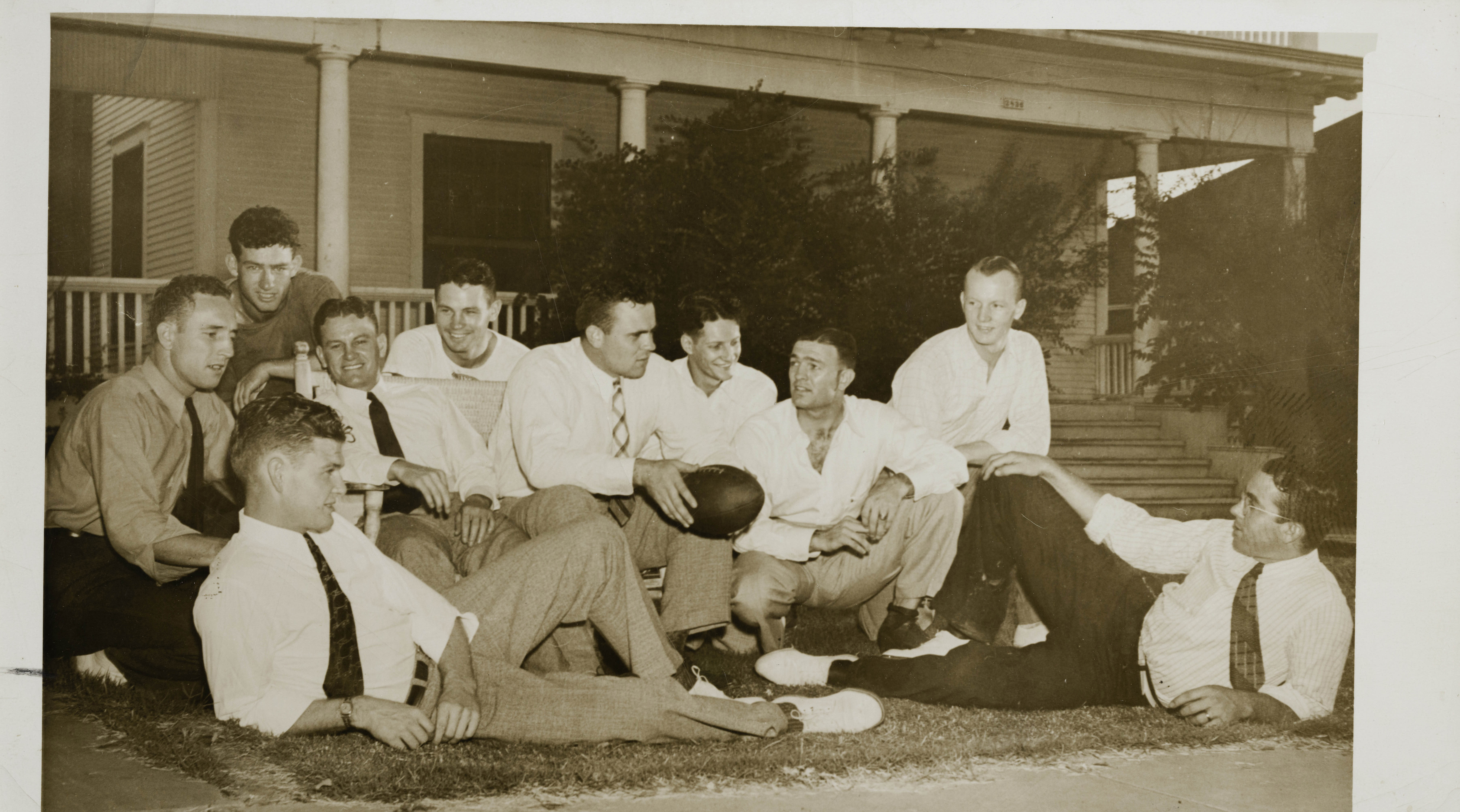 Group of Ten Gamma Upsilon Chapter Members With Football Photograph, 1937
