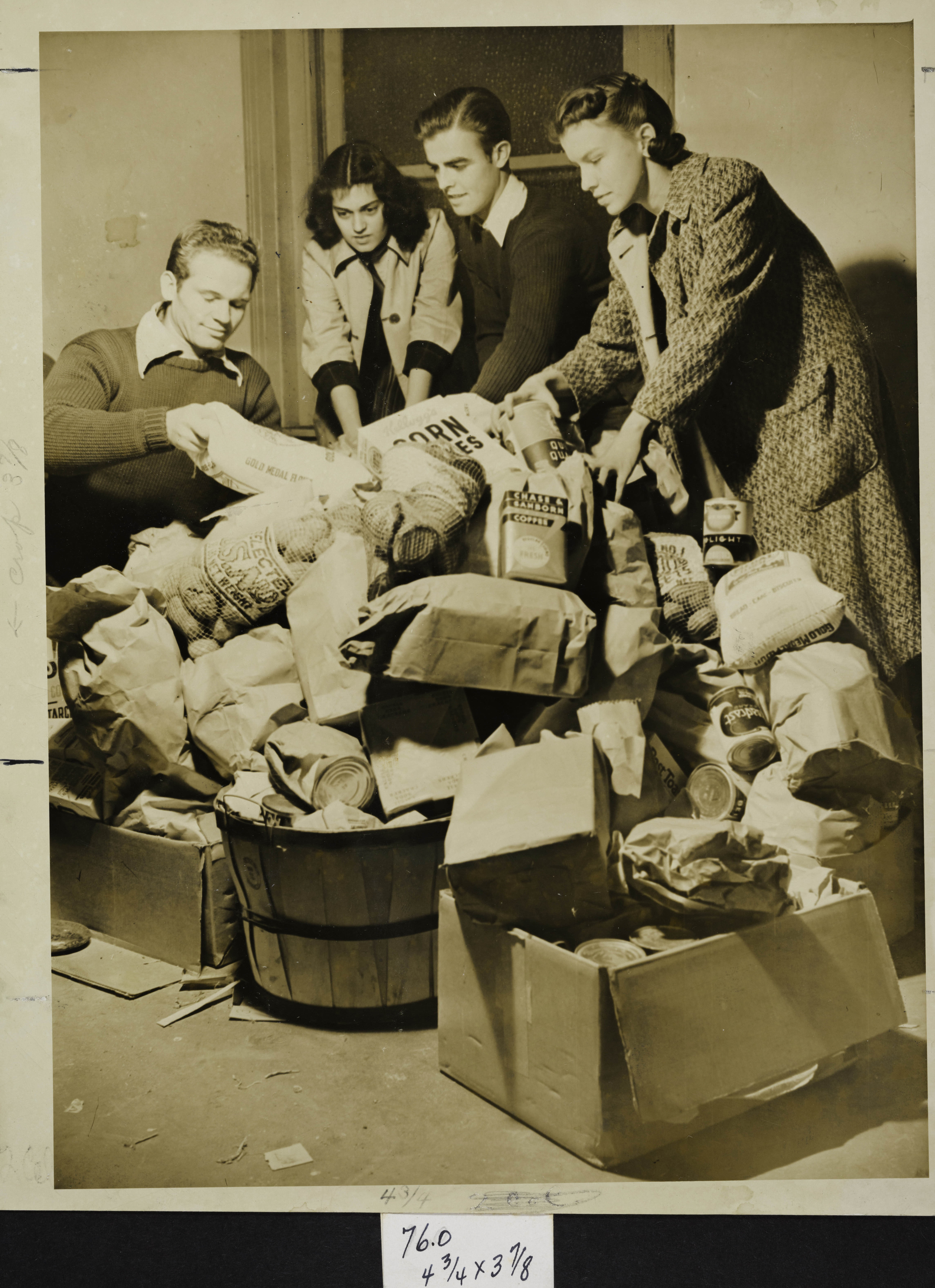 Jackson, Shields, Blaylock and Armstrong Organizing Groceries for Thanksgiving Dance Photograph, 1938