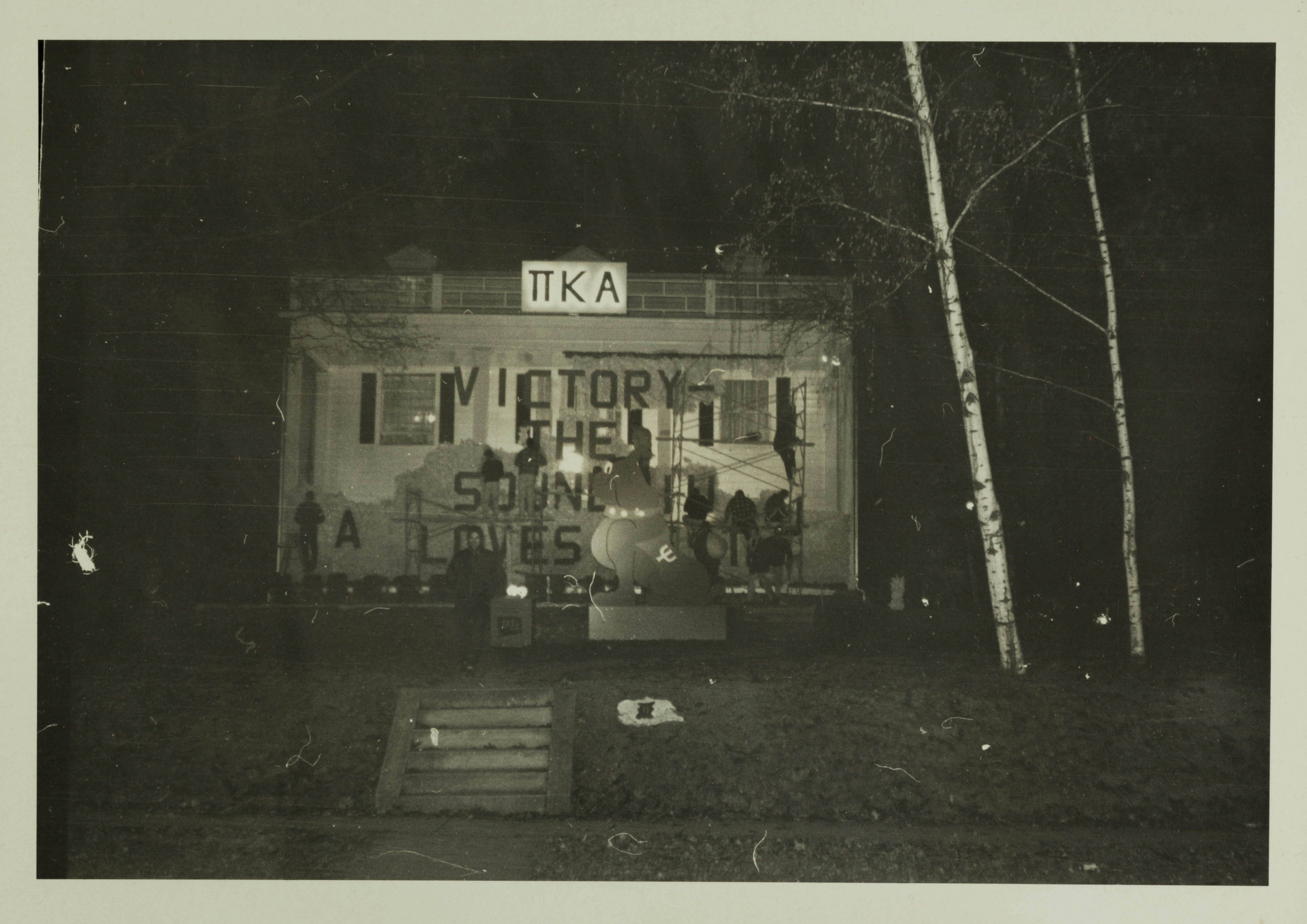 Delta Xi Chapter Constructing Homecoming Display Photograph, 1964