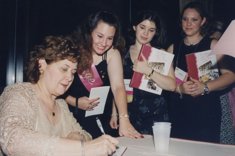 Mary Jane Johnson Signing Copies of The History of Phi Mu Photograph, 2002 (Image)