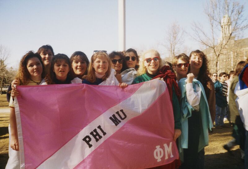 Pi Greek Week Winners with Flag Photograph, 1995 (Image)