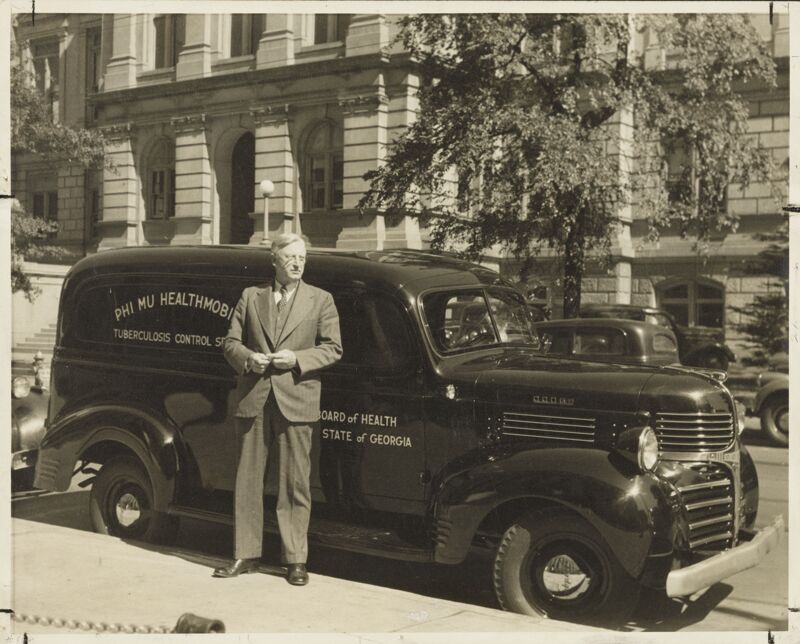 1940 Dr. Joe Bowdoin with the Final Phi Mu Healthmobile Photograph Image