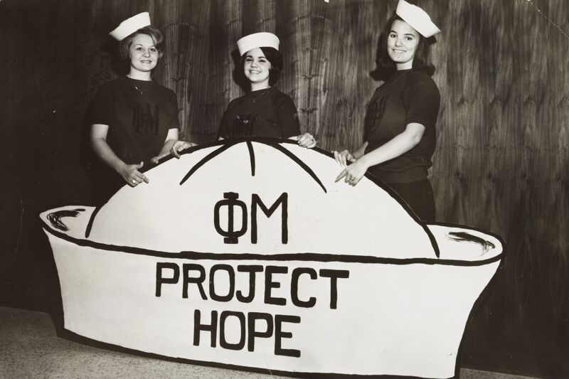 Alpha Sigma Members with Giant Project HOPE Hat Photograph (Image)