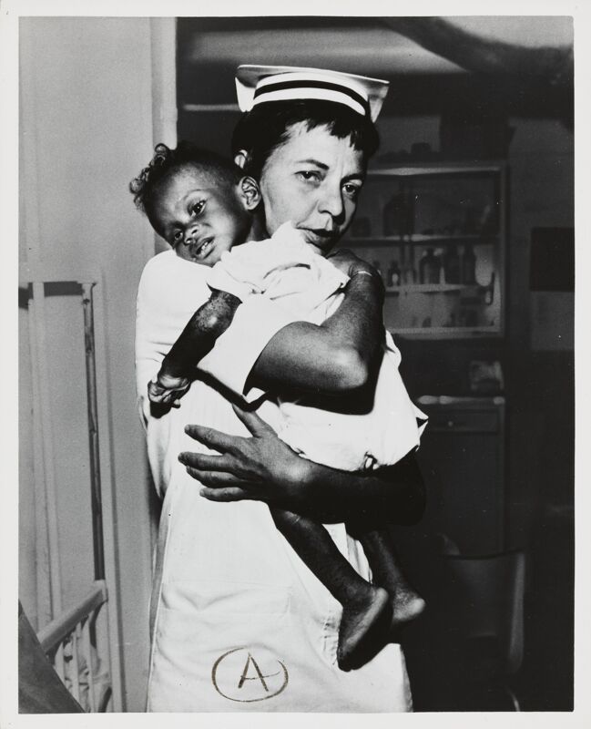 Project HOPE Nurse with Child Photograph, 1974 (Image)