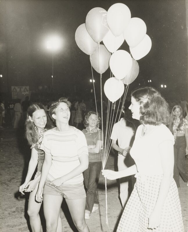 Spring 1977 Gamma Lambda Members with Balloons at Campus Carnival Photograph Image