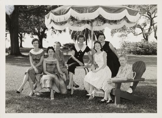 Group of Seven Under Umbrella at Convention Photograph, June 24-30, 1956 (image)
