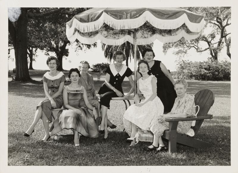 June 24-30 Group of Seven Under Umbrella at Convention Photograph Image