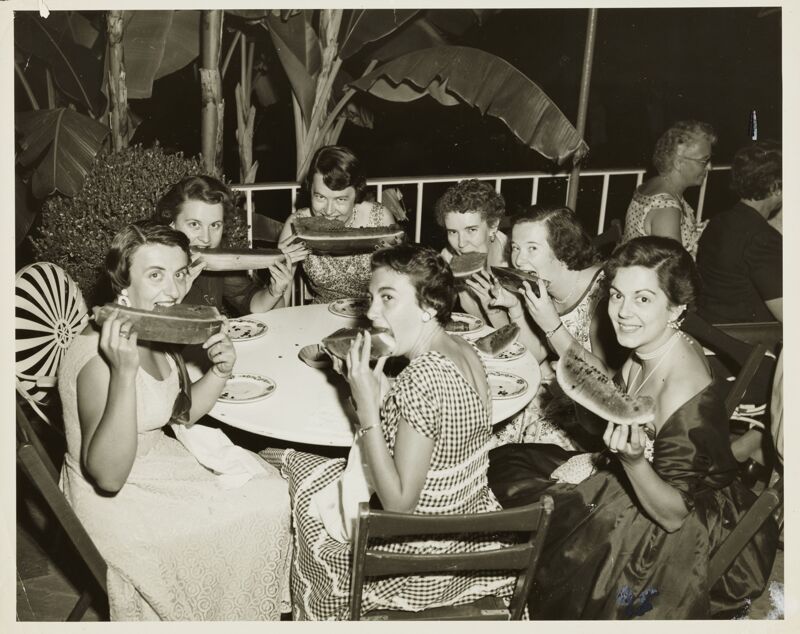 Convention Attendees Eating Watermelon Photograph, 1954 (Image)