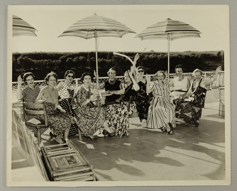 Group of 10 Under Umbrellas at Convention Photograph, June 24-30, 1956 (Image)