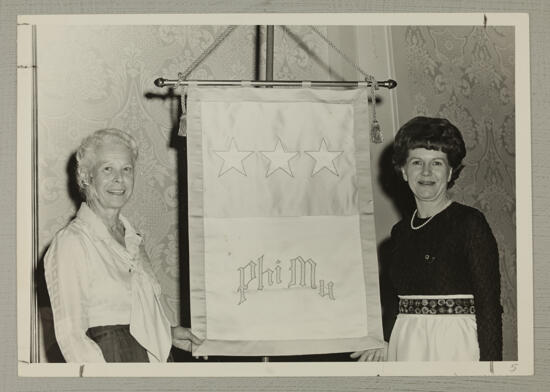 Genevieve Munger and Martha Pugh With Phi Mu Flag at Convention Photograph, July 7-12, 1972 (image)