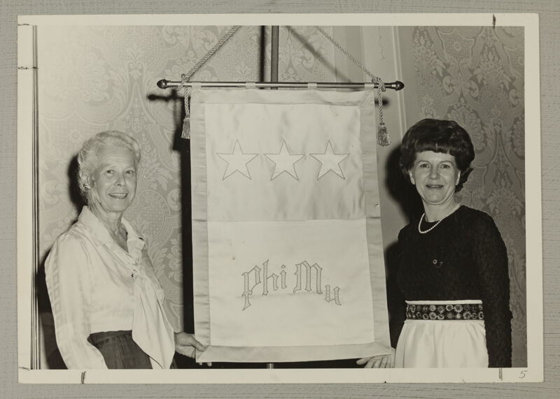 Genevieve Munger and Martha Pugh With Phi Mu Flag at Convention Photograph, July 7-12, 1972 (Image)