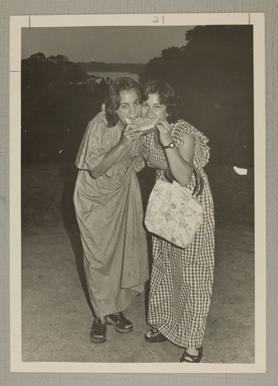 Two Phi Mus Eat Watermelon at Convention Photograph, June 25-30, 1976 (image)