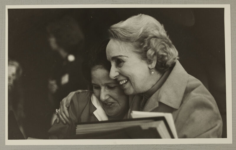 Nancy Cadwallader and Polly Booth Hug at Convention Photograph, June 29-July 3, 1980 (Image)