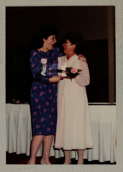 Linda Litter Presenting Outstanding Collegiate Member Award to Anne Burnette Photograph, June 30-July 5, 1984 (image)