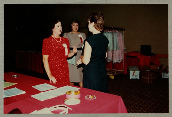 Shellye McCarty, Cookie Keller, and Unidentified Talk in Convention Office Photograph, June 30-July 5, 1984 (image)