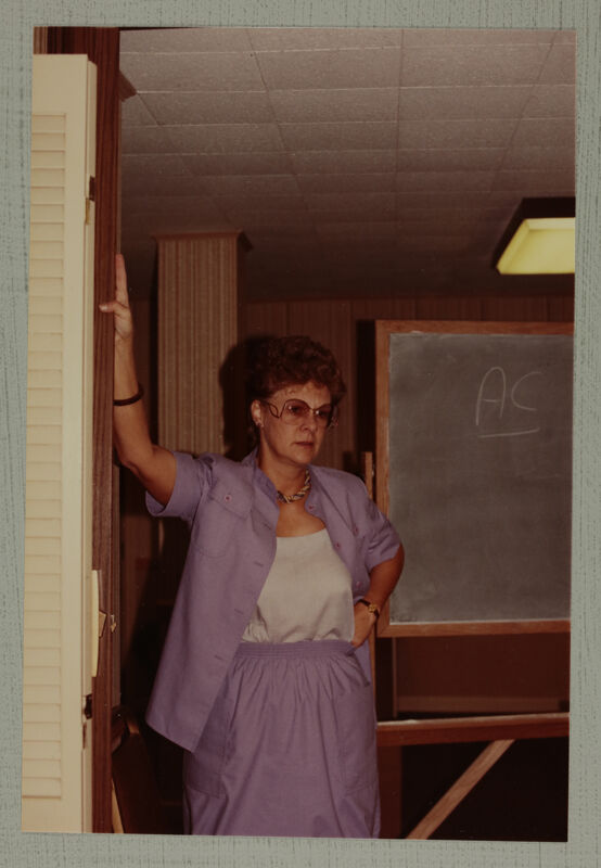 Linda Litter by Chalkboard at Convention Photograph, June 30-July 5, 1984 (Image)