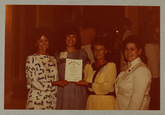 Cox, Litter, Johnson, and Unidentified with Certificate at Convention Photograph, June 30-July 5, 1984 (image)