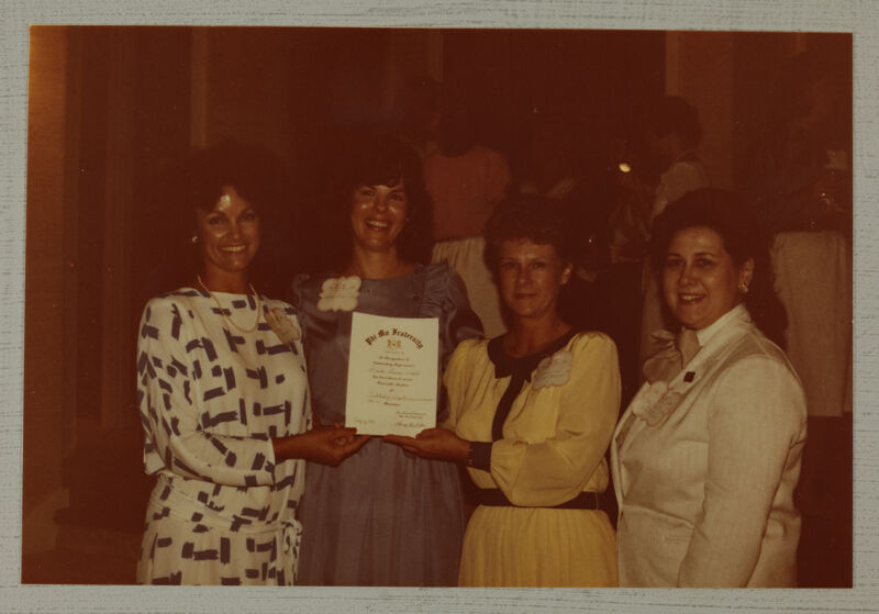 Cox, Litter, Johnson, and Unidentified with Certificate at Convention Photograph, June 30-July 5, 1984 (Image)