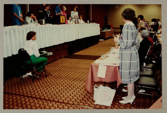 Head Table and Reporter at Convention Session Photograph, June 30-July 5, 1984 (image)