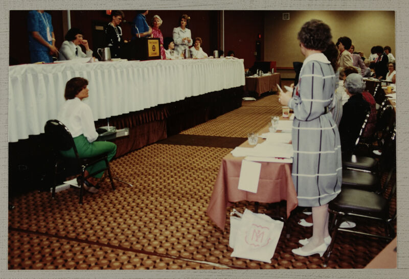 Head Table and Reporter at Convention Session Photograph, June 30-July 5, 1984 (Image)