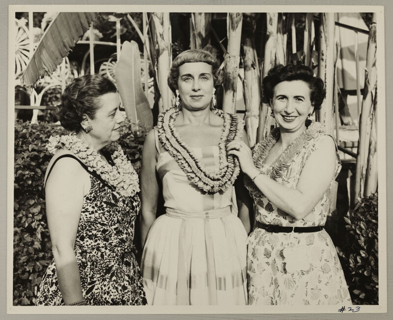 Unidentified, Freear, and Watson in Leis at Convention Photograph, July 11, 1954 (Image)