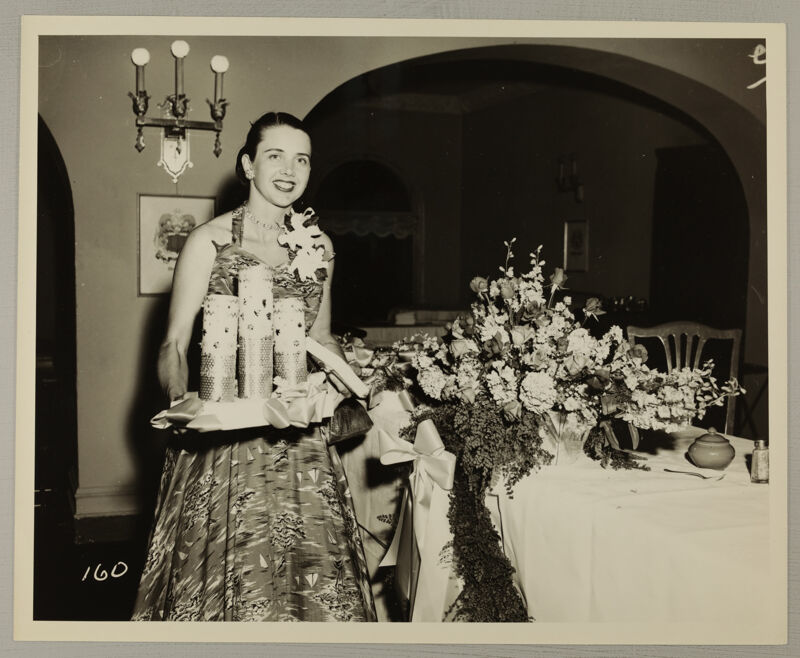 Unidentified Phi Mu Carrying Candles at Convention Photograph, July 11-16, 1954 (Image)
